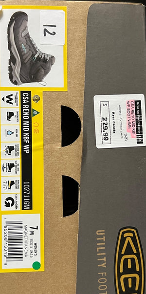 Box of Klim utility footwear with a visible size label and branding.