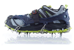 Snow shoe with crampon spikes on a white background