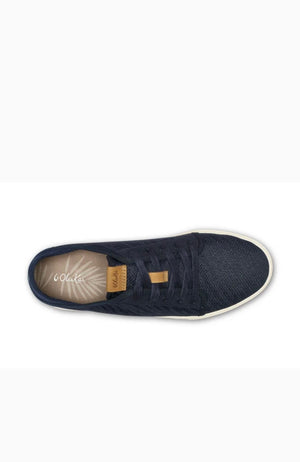 Navy blue sneaker with a visible brand logo on a white background