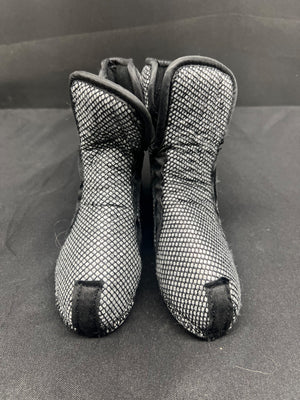 Pair of black and gray mesh boots on a gray background