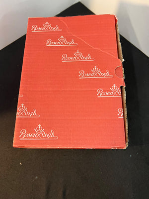 Red box with 'Rosenthai' branding on a black surface