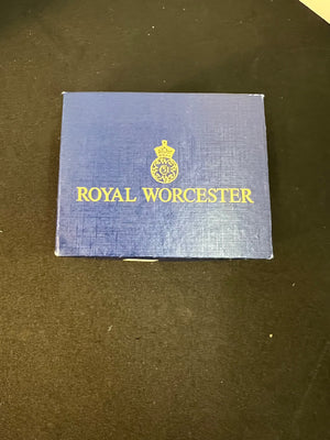 Blue box with 'Royal Worcester' logo on a dark surface