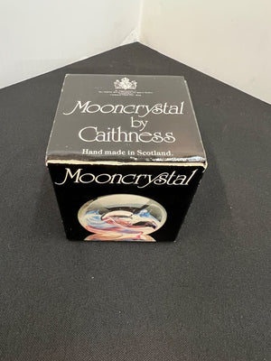 Box of Mooncrystal by Caithness on a black surface