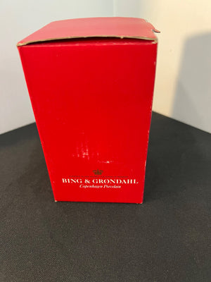 Red box with 'Bing & Grondahl' branding on a dark surface.