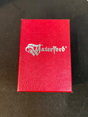 Red box with Waterford logo on a dark surface