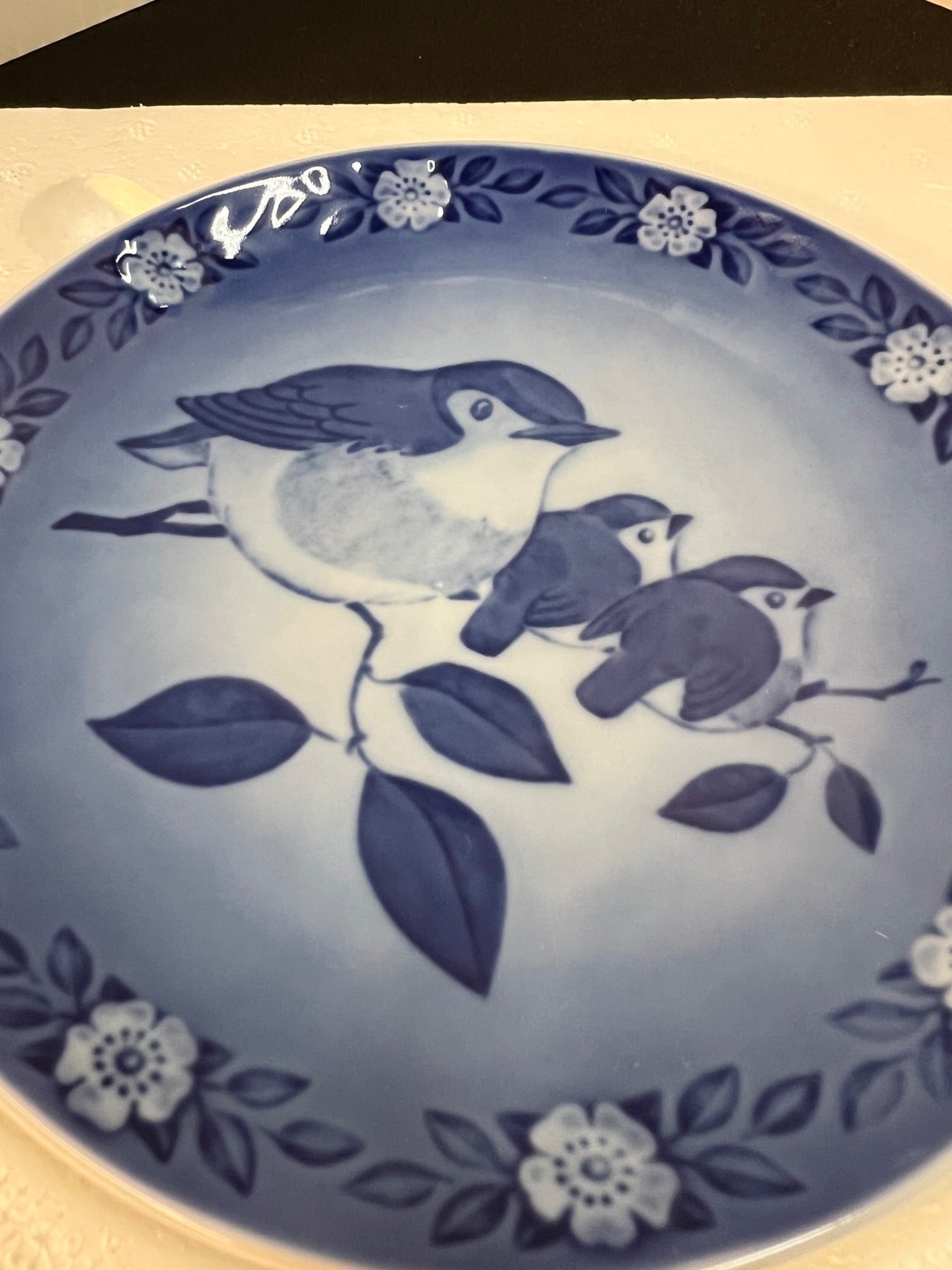 Blue and white ceramic plate with bird design