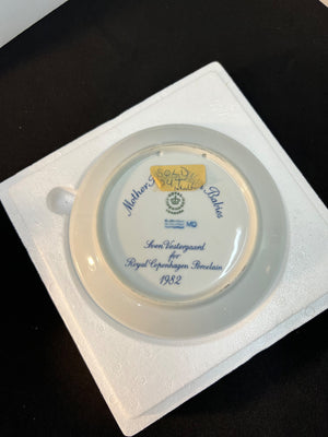 Decorative plate with text and logo on a white background