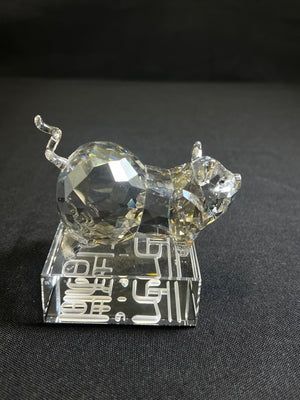 Crystal cat figurine on a black background