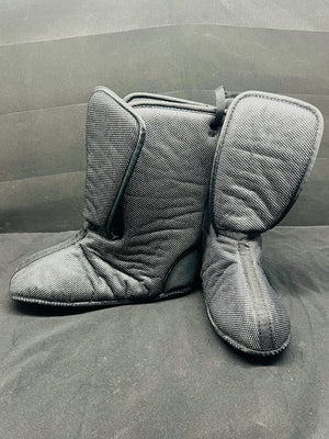 Pair of gray slippers on a gray surface