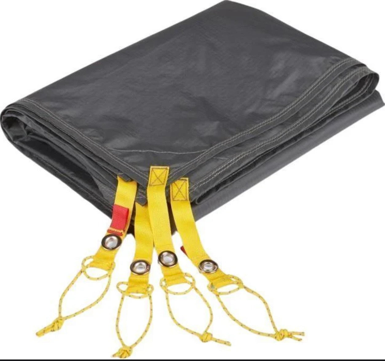 Black tarp with yellow straps and red accents on a white background
