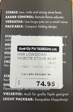 Product packaging with a label for MSR Low Down Remote Stove Adapter on a black background.