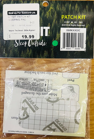 Patch kit packaging with GEAR-UP FOR OUTDOORS LTD. branding on a wooden surface.
