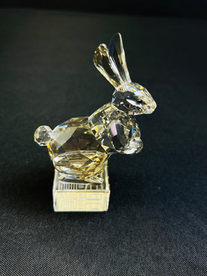 Crystal rabbit figurine on a black background