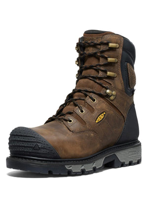 Brown work boot with black sole on a white background