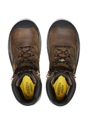 Pair of brown work boots with yellow sole on a white background