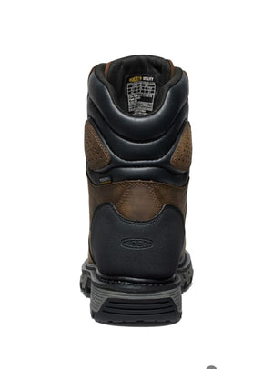 Black and brown work boot on a white background