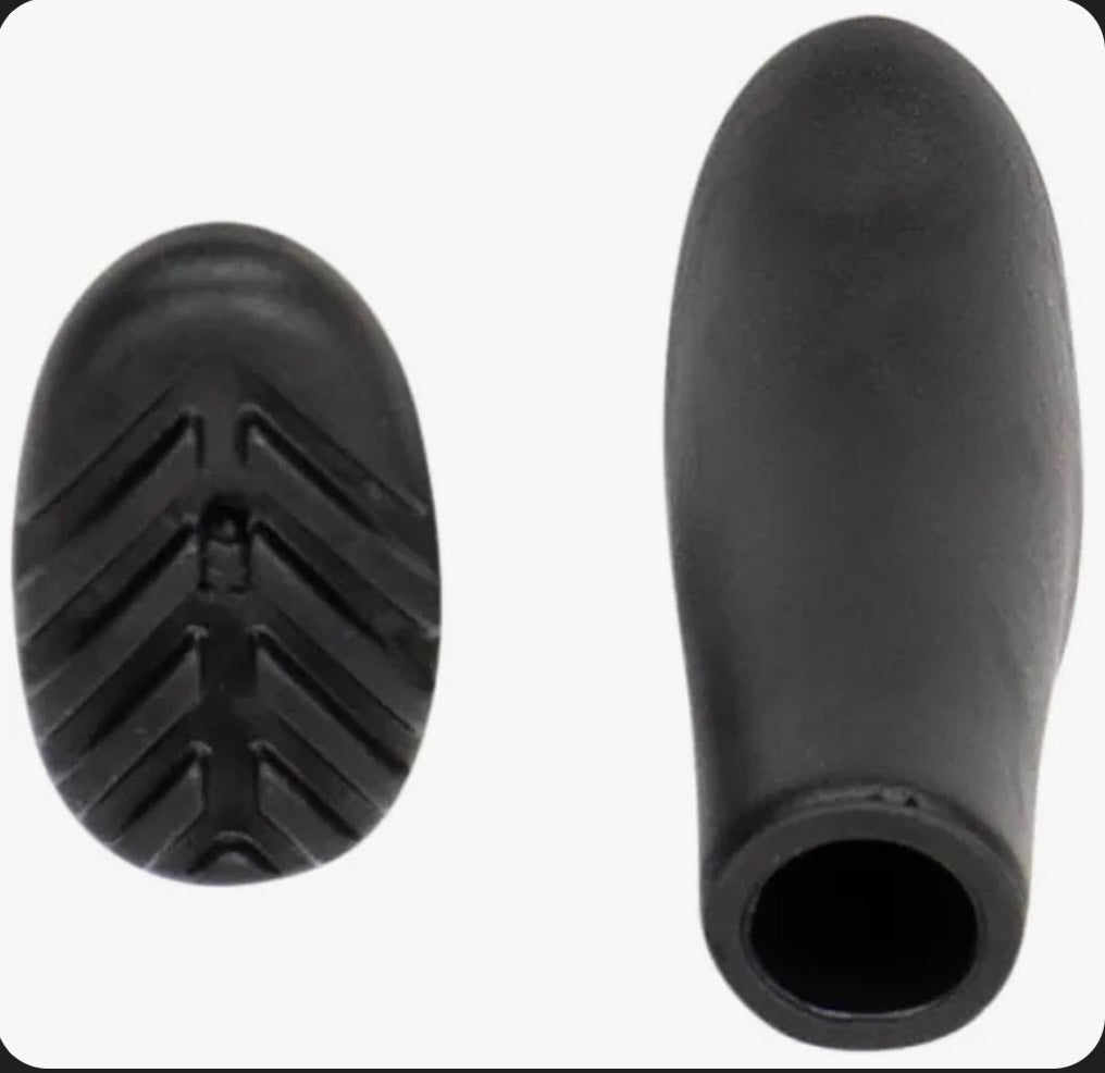 Black rubber boot sole with tread pattern on a white background