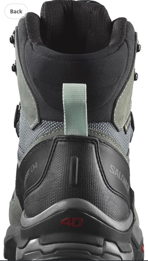 Close-up of a gray hiking boot with visible brand logo on a white background