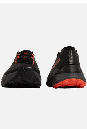 Black and red athletic shoes on a white background