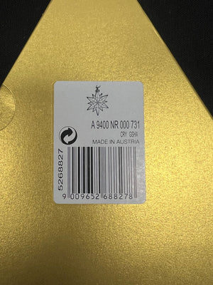 Label with product details on a gold surface