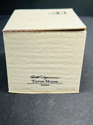 Beige box with 'Turun Hopea' branding on a dark background