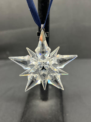 Crystal star ornament on a black background