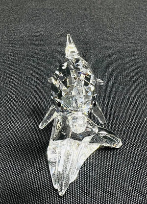 Clear crystal object on a textured black surface