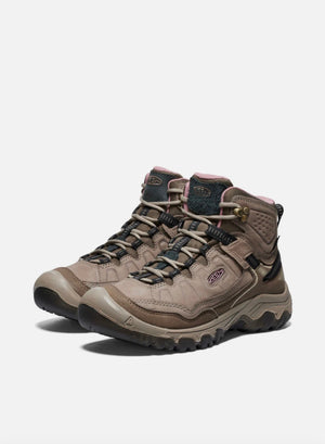 Pair of brown hiking boots on a white background
