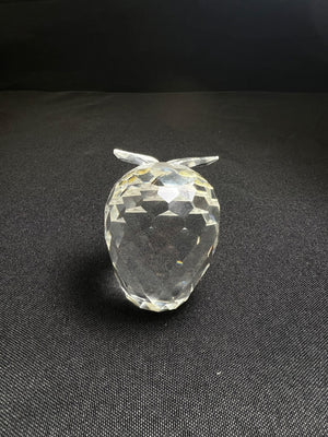 Clear crystal pineapple figurine on a black background