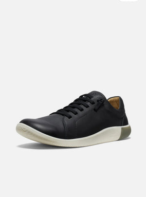 Black leather sneaker on a white background