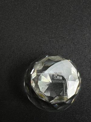 Clear crystal ball with 'LG' branding on a black background