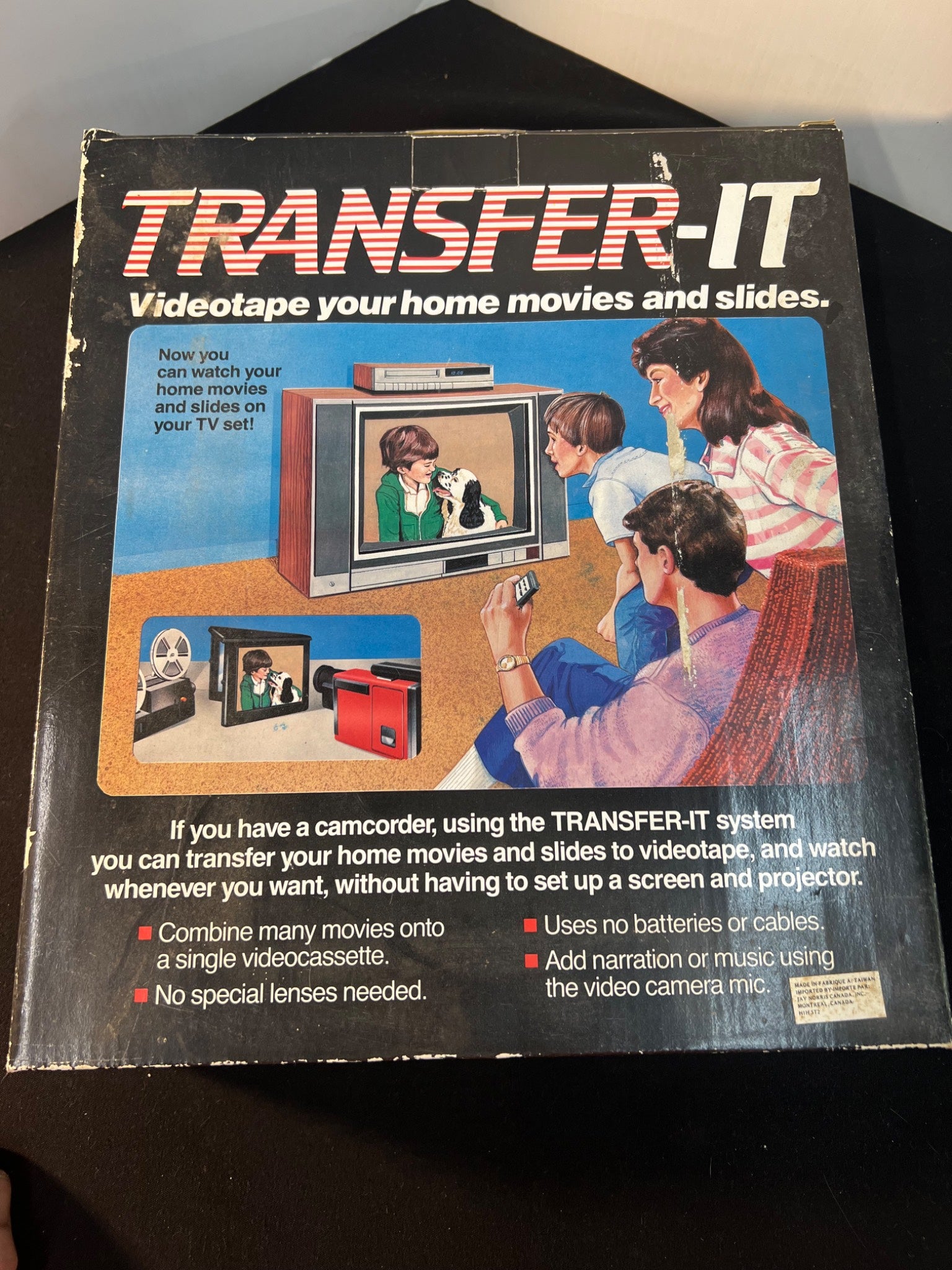 Advertisement for Transfer-It videotape system showing a family using a television.