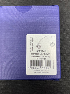 Purple product packaging with a label on a black background