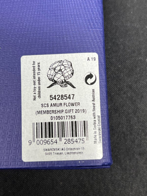 Label on a purple product with text and a barcode