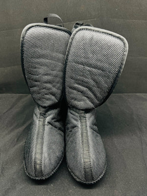 Pair of gray mesh oven mitts on a dark surface