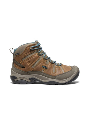 Brown hiking boot with gray sole on a white background