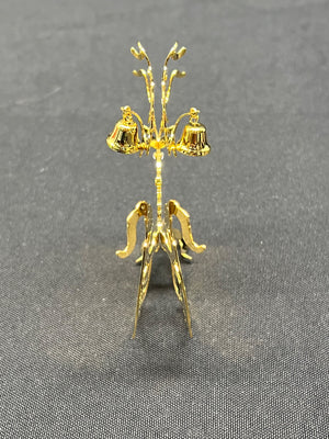 Gold decorative stand on a gray background