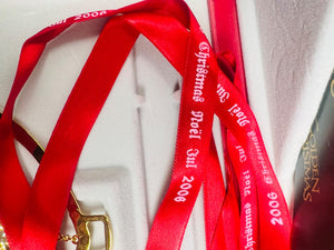 Red ribbons with text on a white background