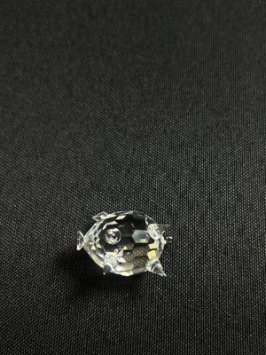 Clear rhinestone on a black fabric background