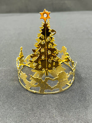 Gold Christmas tree-shaped cutout on a gray background