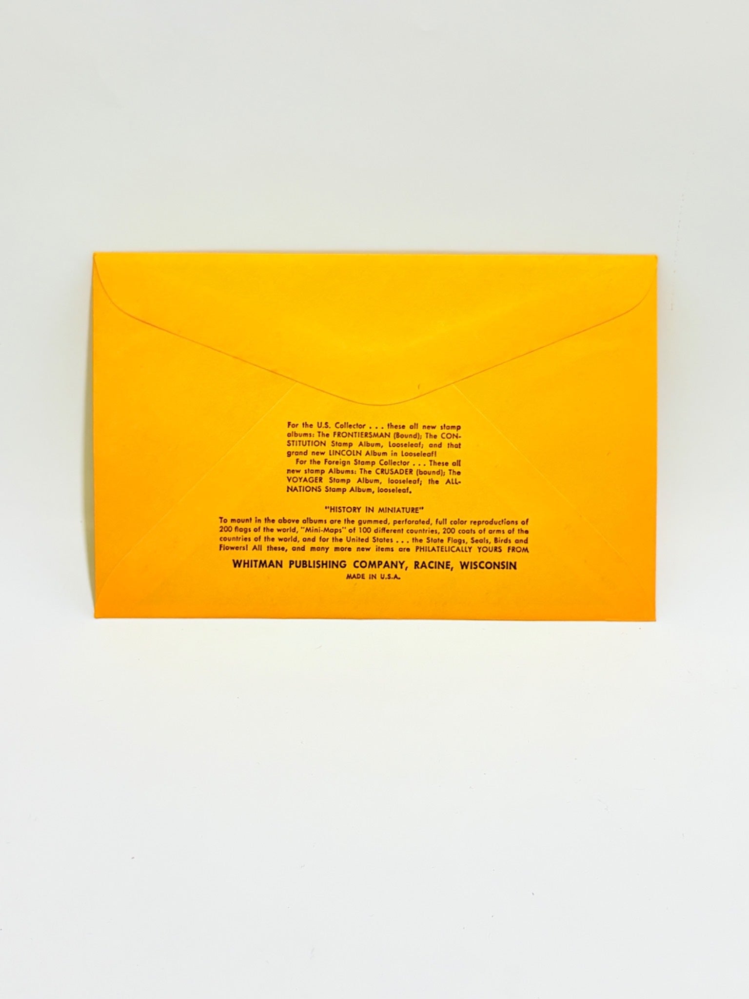 Yellow envelope with text on a light gray background