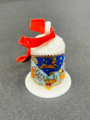 Decorative spool with colorful design and red ribbon on a gray background