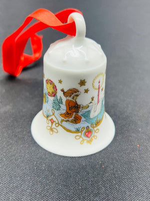 Decorative bell ornament with Christmas design on a gray background