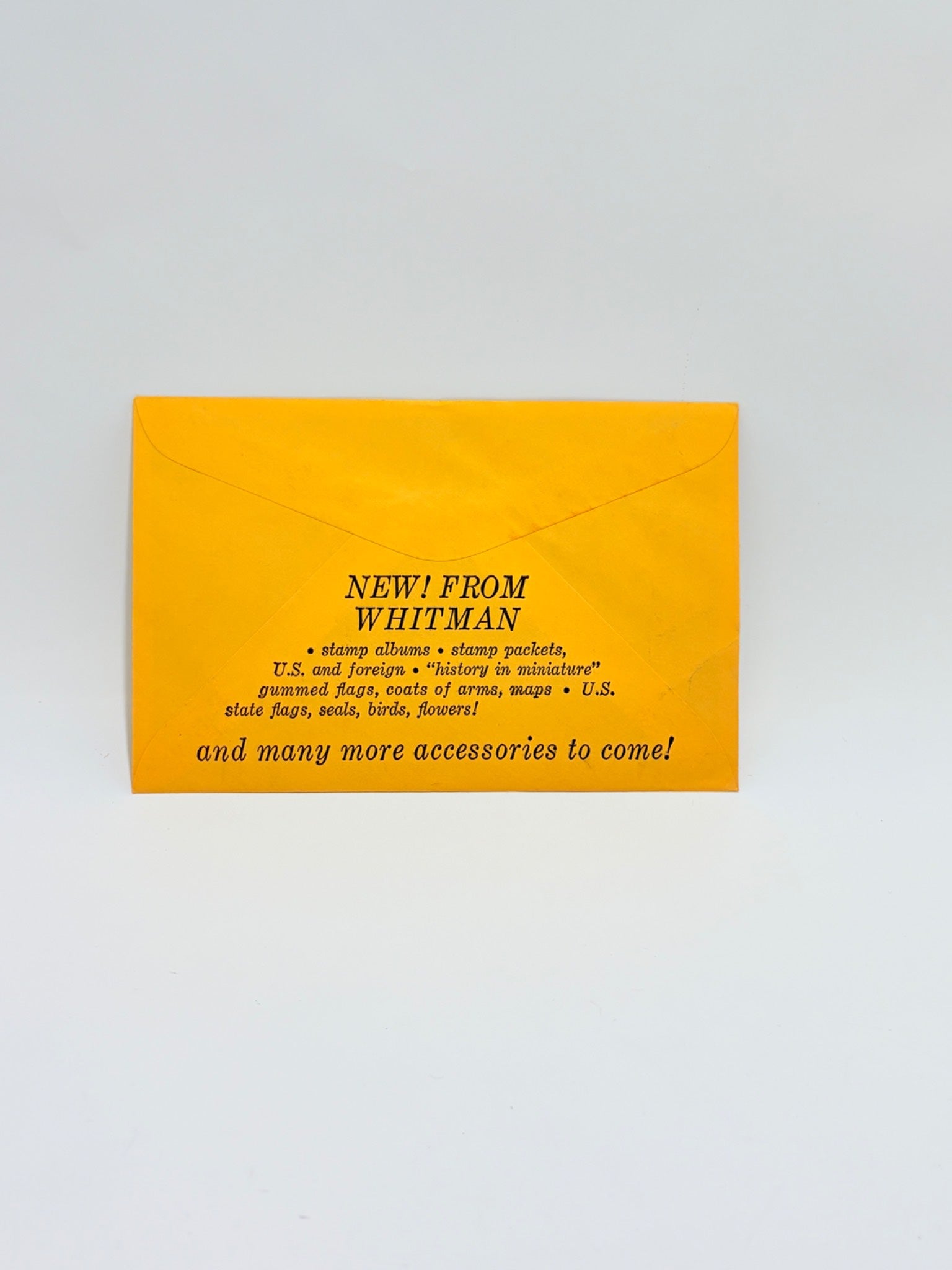 Yellow envelope with black text on a light gray background