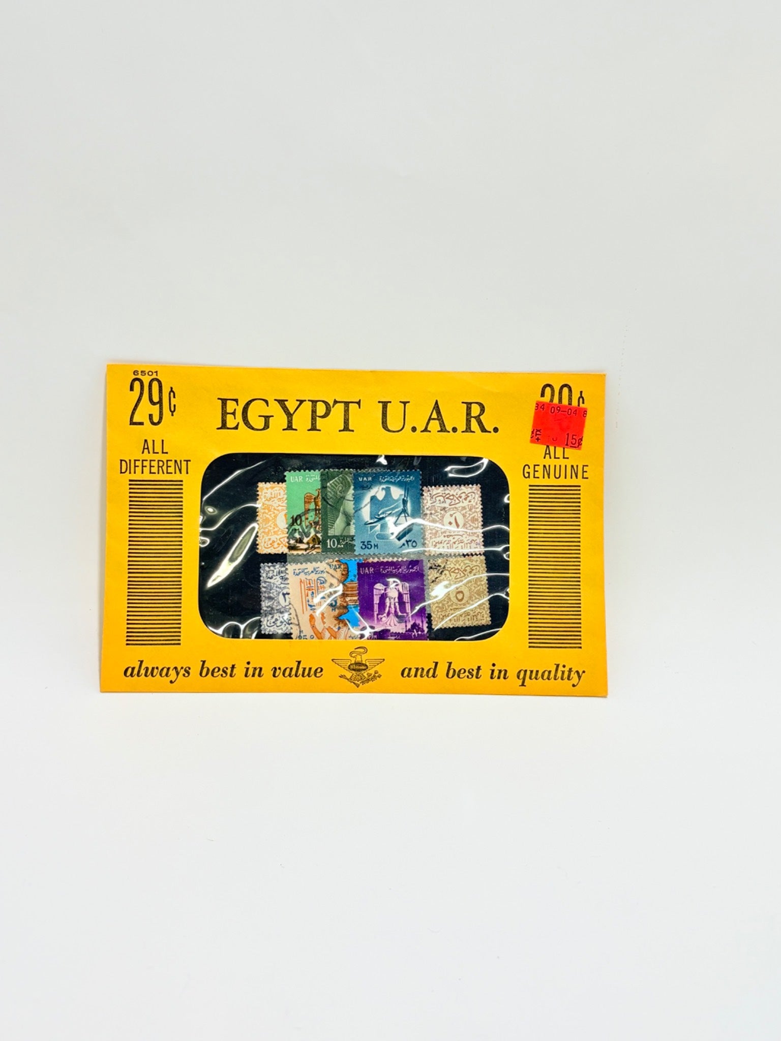 Collection of Egyptian stamps in a display case with a yellow border on a light gray background