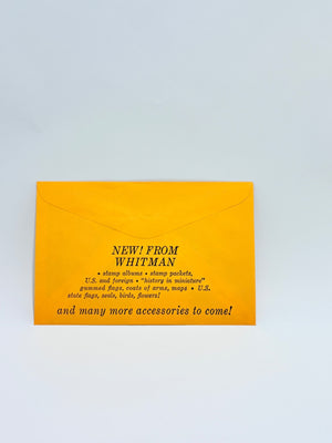 Yellow envelope with black text on a light gray background