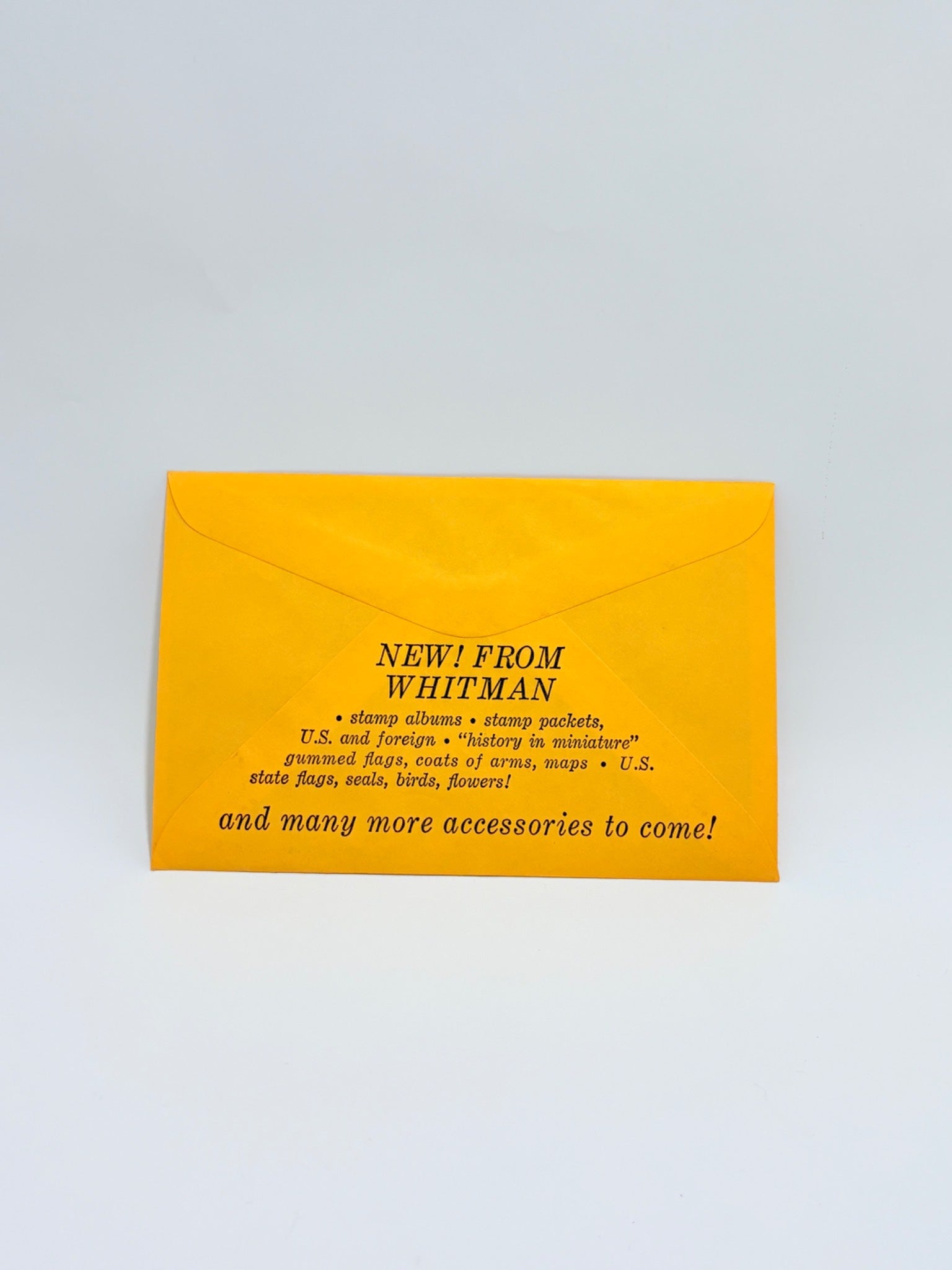 Yellow envelope with black text on a light gray background