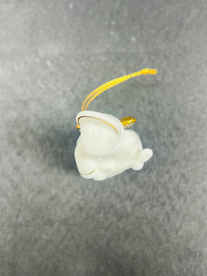 White figurine on a gray background