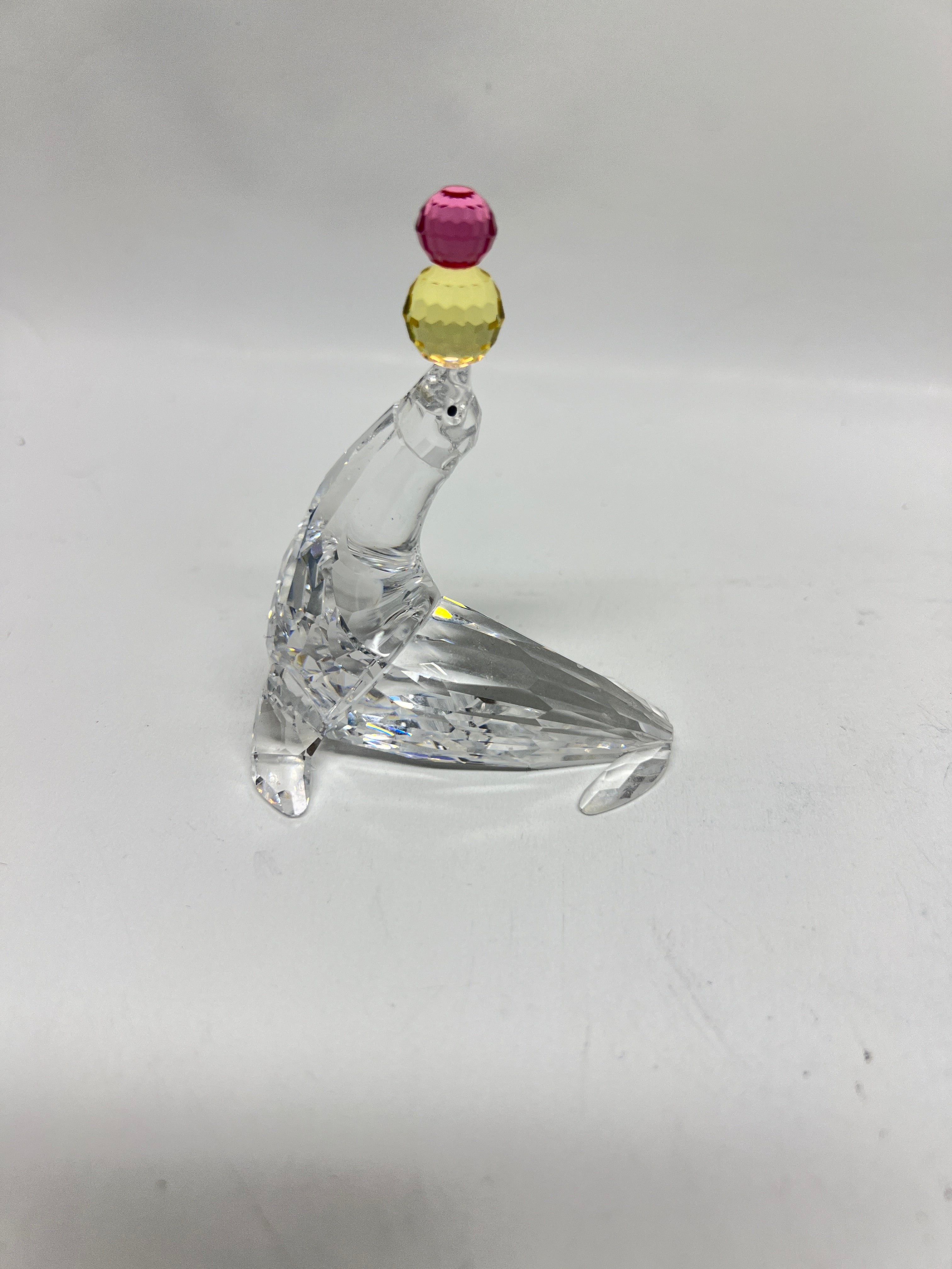 Swarovski Crystal Playing Seal with Pink and Yellow Balls #622526