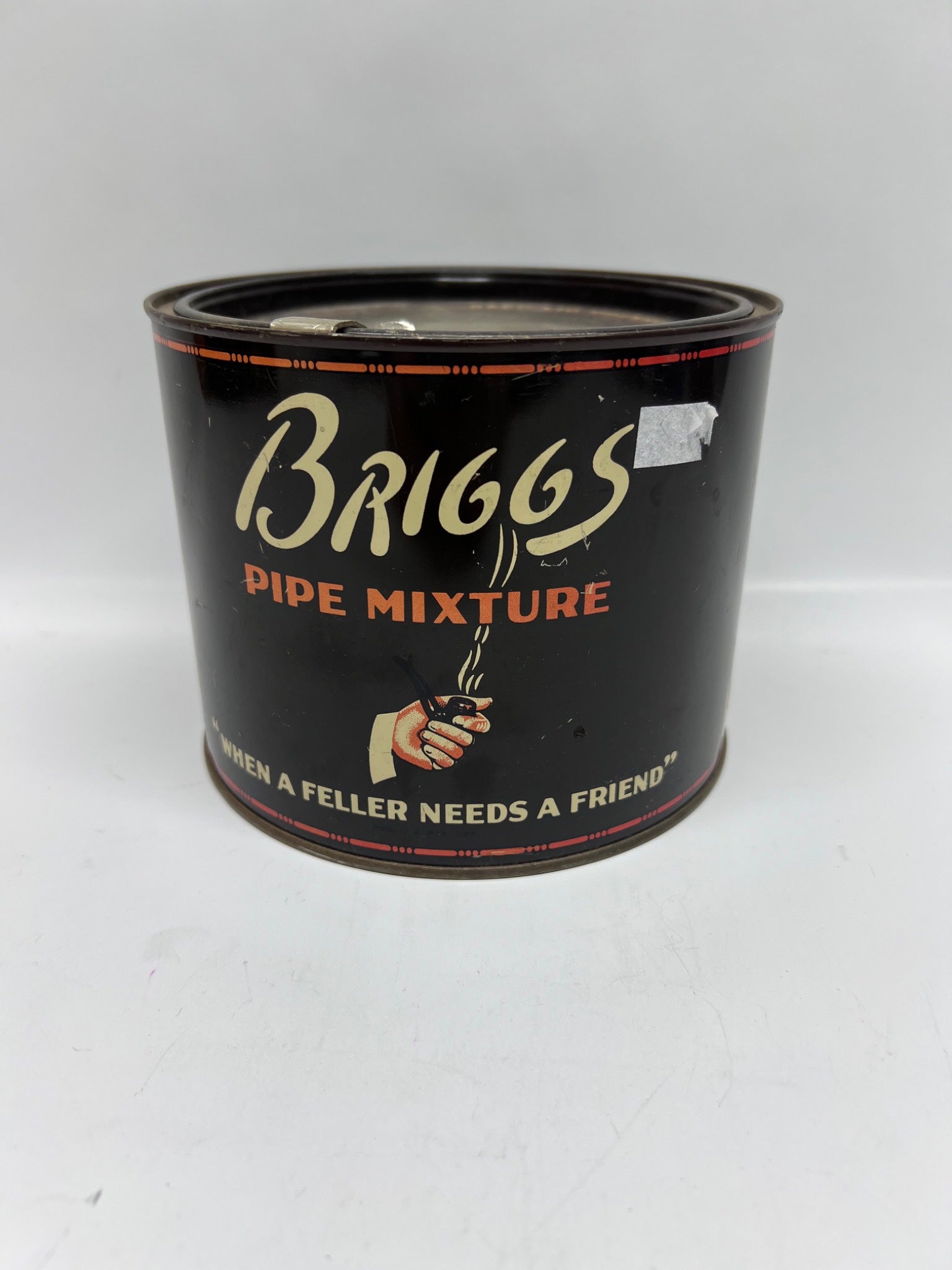 Black can of Briggs Pipe Mixture on a white background
